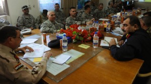 Coaliton officers meet with Iraqi security officials from southern Iraq to discuss boarder enforcement during the Maysan Security Conference held near Amarah, Iraq, Nov. 15.